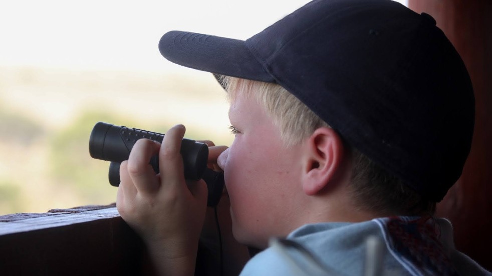 Young boy birdwatching